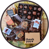 Large chocolate gift boxes include a thank you card and handmade chocolates from Kalona, Iowa.