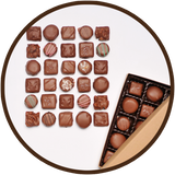 Assortment of handmade milk chocolates in a large gift collection. Made in Kalona, Iowa.