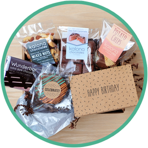 Birthday chocolate gift boxes include a birthday card and handmade chocolates from Kalona, Iowa.