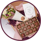 A handmade chocolate collection and flowers gift box for mothers day.