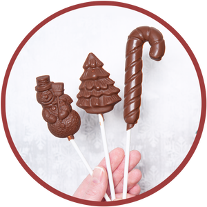 Three christmas chocolate lollipops molded in Kalona, Iowa.