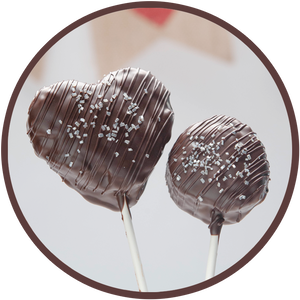 Dark chocolate cocoa krispy treat lollipop, shaped like a heart.