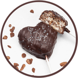 Dark chocolate cocoa krispy treat lollipop, shaped like a heart.