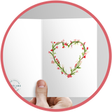 Heart shaped wreath on a Valentine's Day painted card.