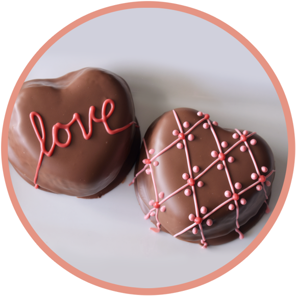 Chocolate cake and white cake shaped as hearts and covered in chocolate. Made in small batches in Kalona, Iowa.