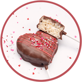 Heart shaped rice krispy treat on a stick and covered in chocolate.