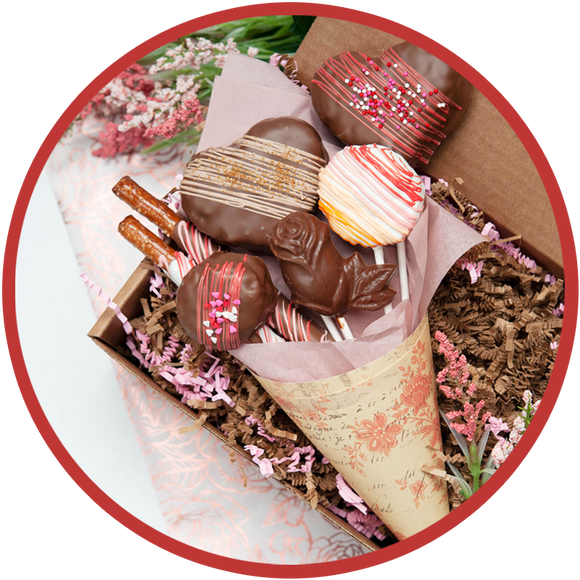 Large valentine chocolate bouquet with chocolate covered pretzel rods, heart krispie pops, and rose lollipops.