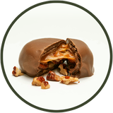 Homemade milk chocolate turtles with caramel and salted pecans