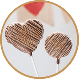 Heart and round peanut butter rice krispie treat lollipops - hand dipped in Kalona, Iowa.