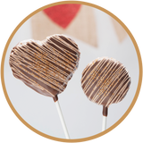 Heart and round peanut butter rice krispie treat lollipops - hand dipped in Kalona, Iowa.