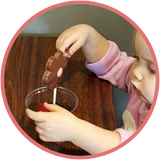 Little girl planting a chocolate flower in oreo cookie dirt with a gummy worm. Such fun! Little kid activities!