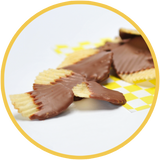 Chocolate covered potato chips are a unique gift for those that like sweet and salty treats. These chocolate covered chips were handmade in Kalona, Iowa.