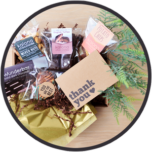 Chocolate gift boxes include a thank you card and handmade chocolates from Kalona, Iowa.