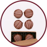 Raspberry chocolate truffles handmade in Kalona, Iowa in a small box.